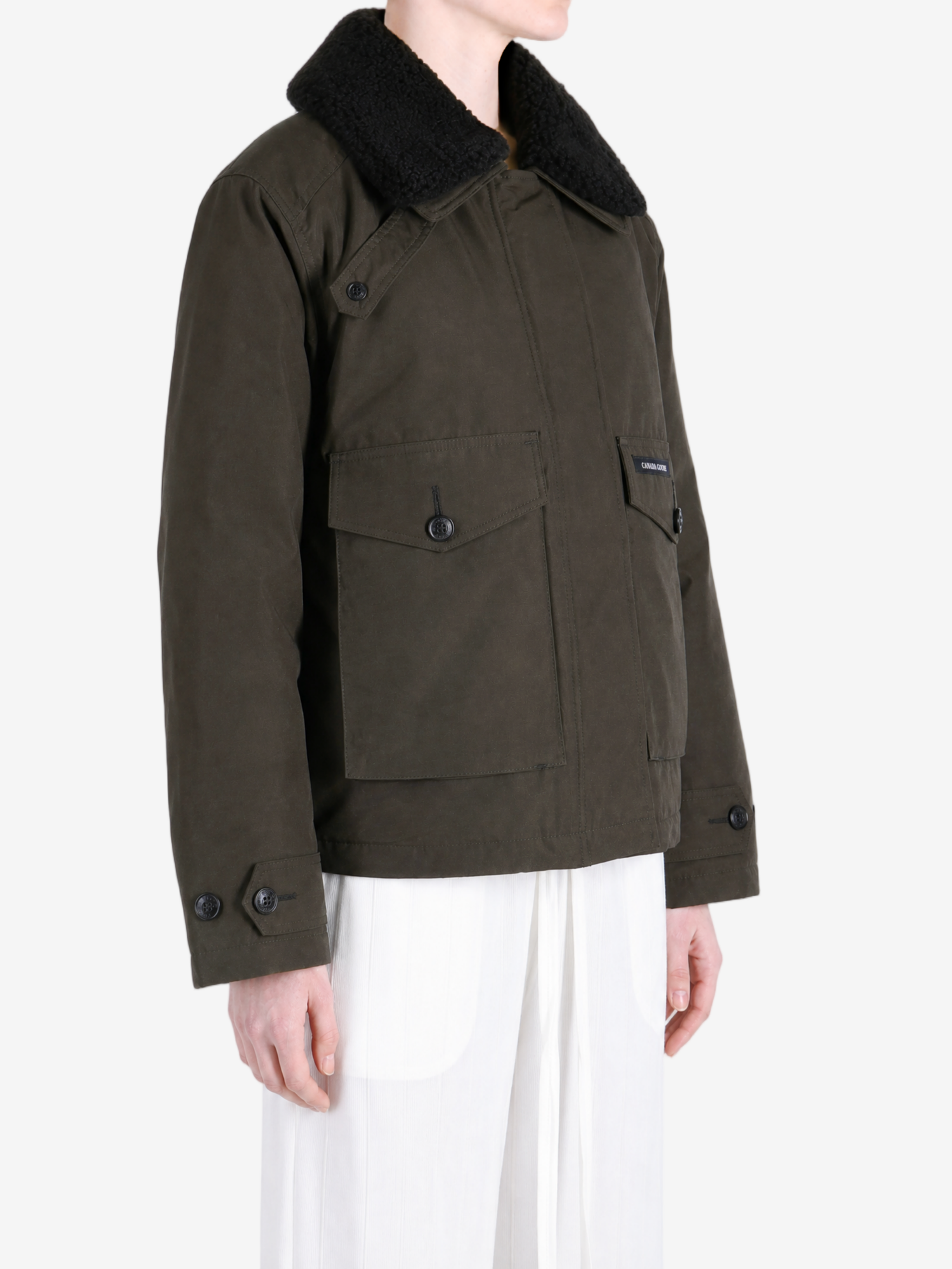 Brown jacket worn by a person, showing the jacket fit