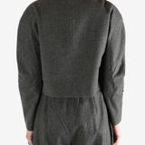 Grey tops worn by a person, showing the tops fit