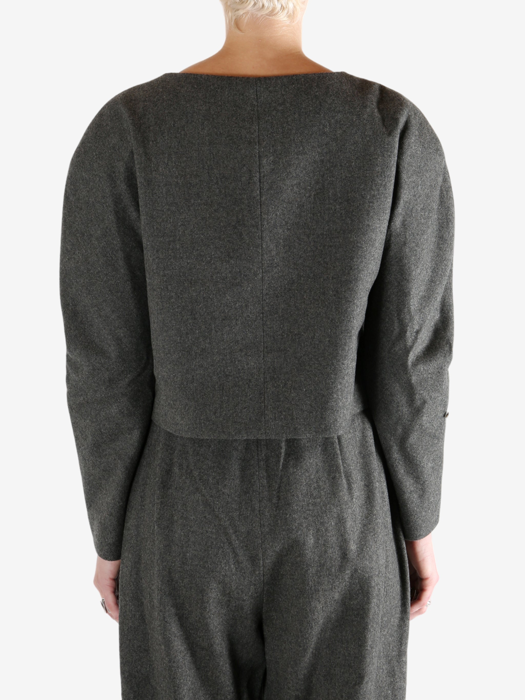 Grey tops worn by a person, showing the tops fit