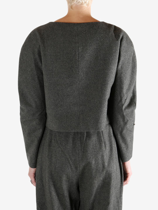 Grey tops worn by a person, showing the tops fit