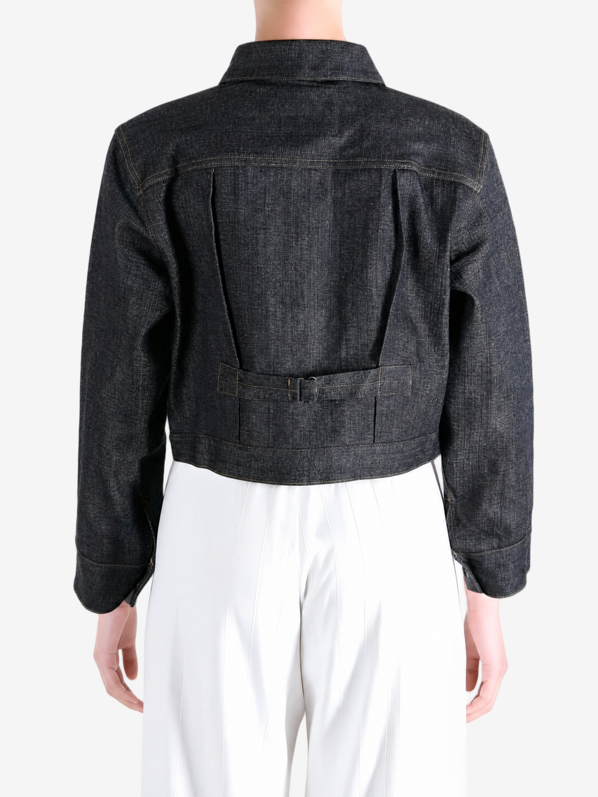 Black jacket worn by a person, showing the jacket fit