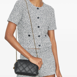 Black bag on the back by a person, showing the bag fit