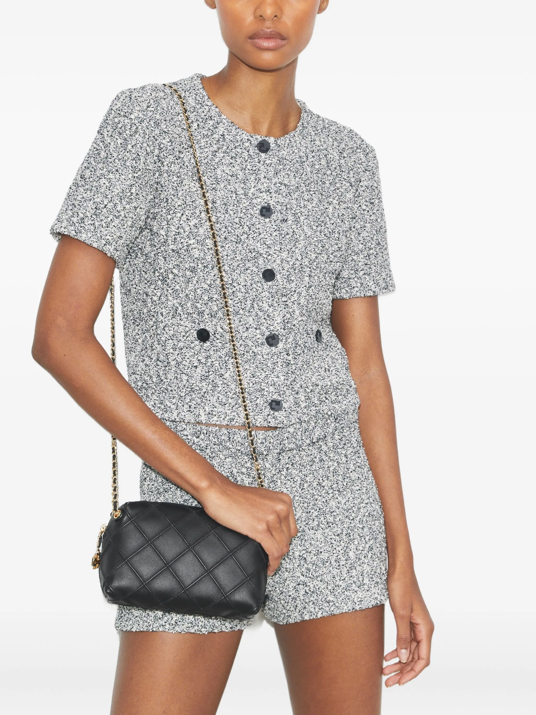 Black bag on the back by a person, showing the bag fit