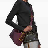 Red bag worn by a person, showing the bag fit