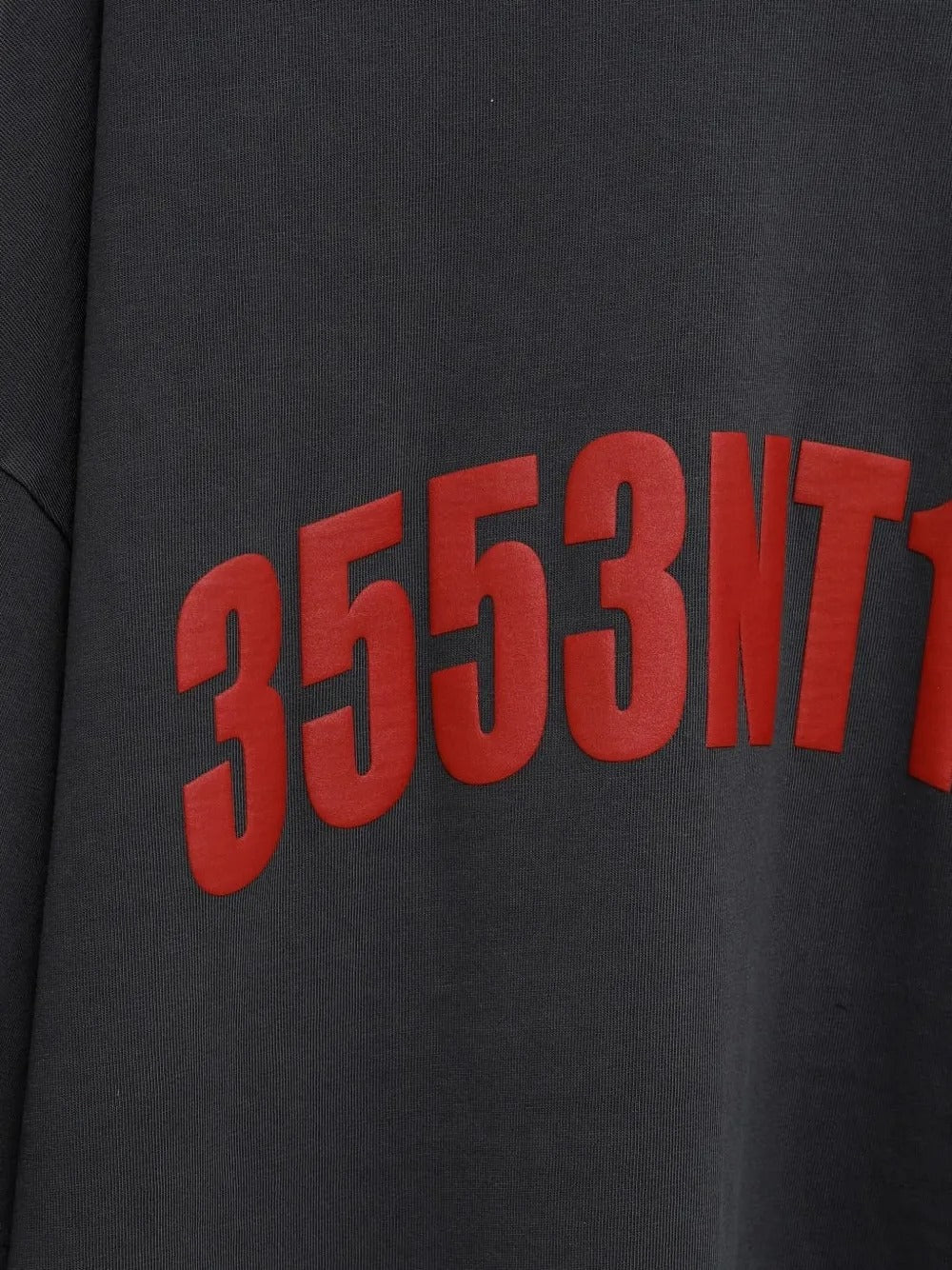 Close up of the grey t-shirt, showing texture of the cotton fabric