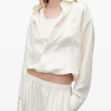 Tan top worn by a person, showing the top fit