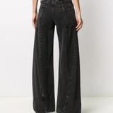 black pants worn by a person, showing the pants fit