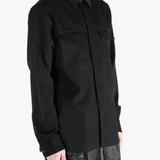 Black shirts worn by a person, showing the shirts fit