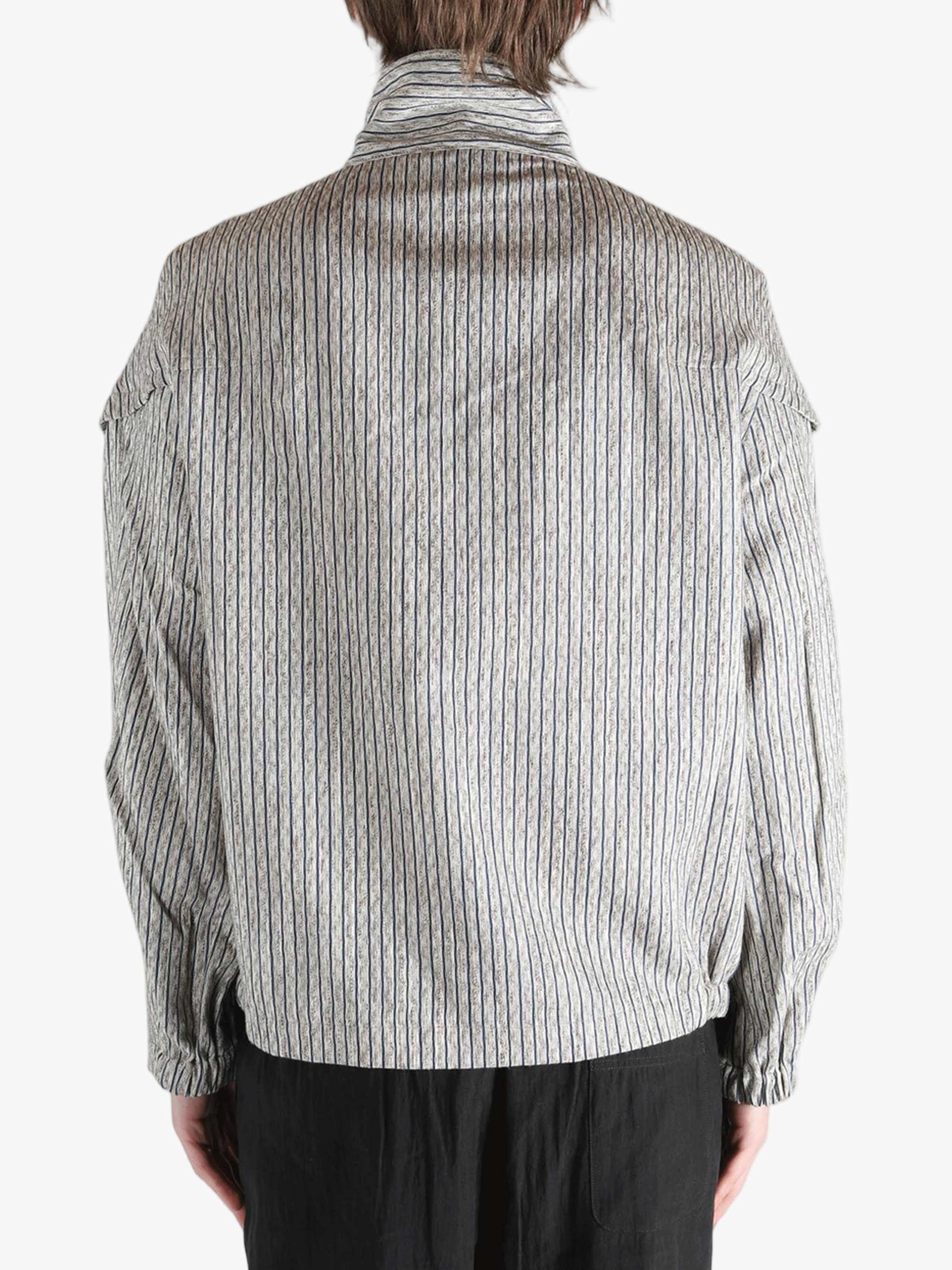 Grey jackets-coats worn by a person, showing the jackets-coats's fit