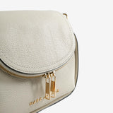 Close up of white bags, showing texture of the split cow leather fabric