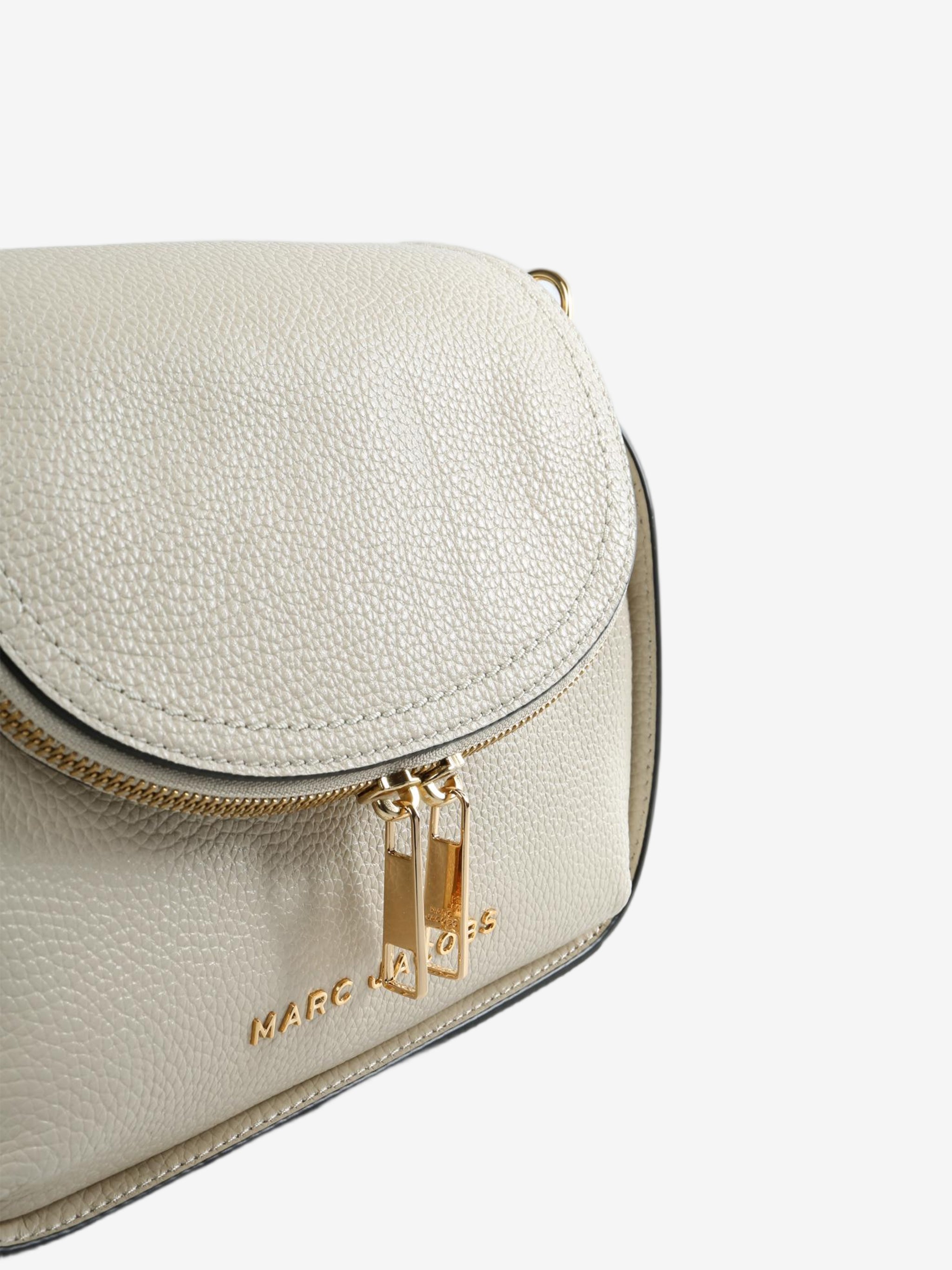 Close up of white bags, showing texture of the split cow leather fabric