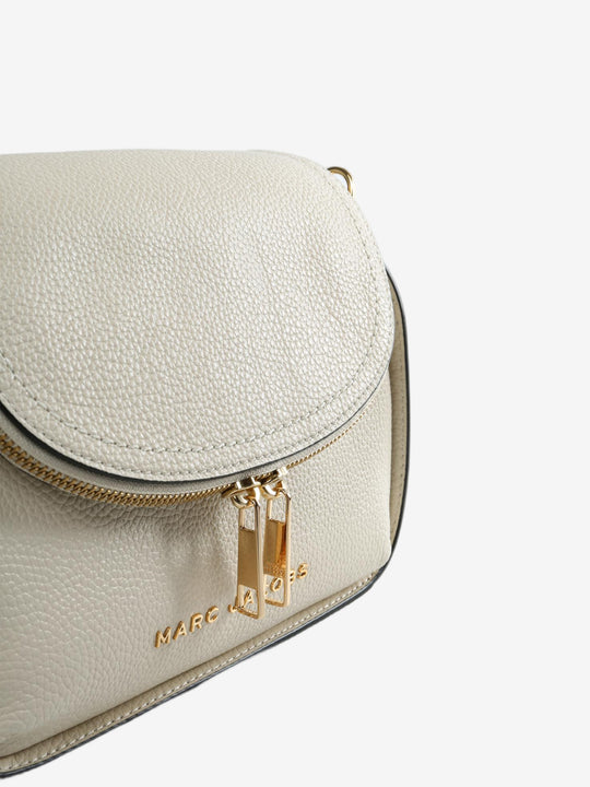 Close up of white bags, showing texture of the split cow leather fabric