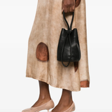 Black bag worn by a person, showing the bag's fit