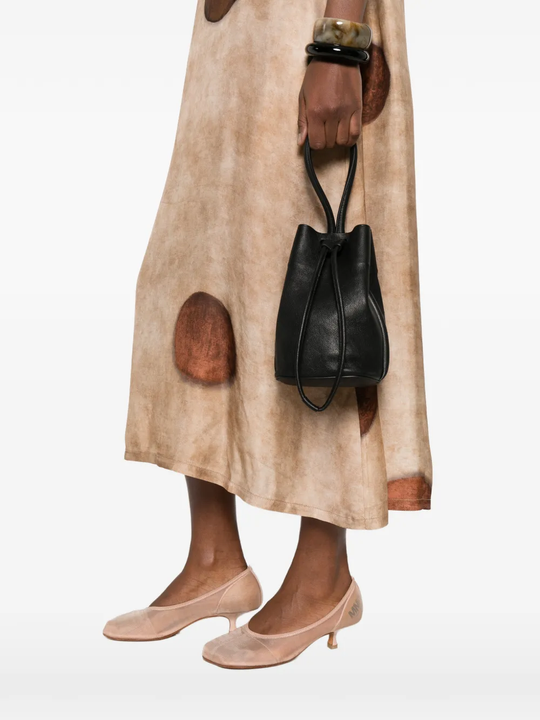 Black bag worn by a person, showing the bag's fit