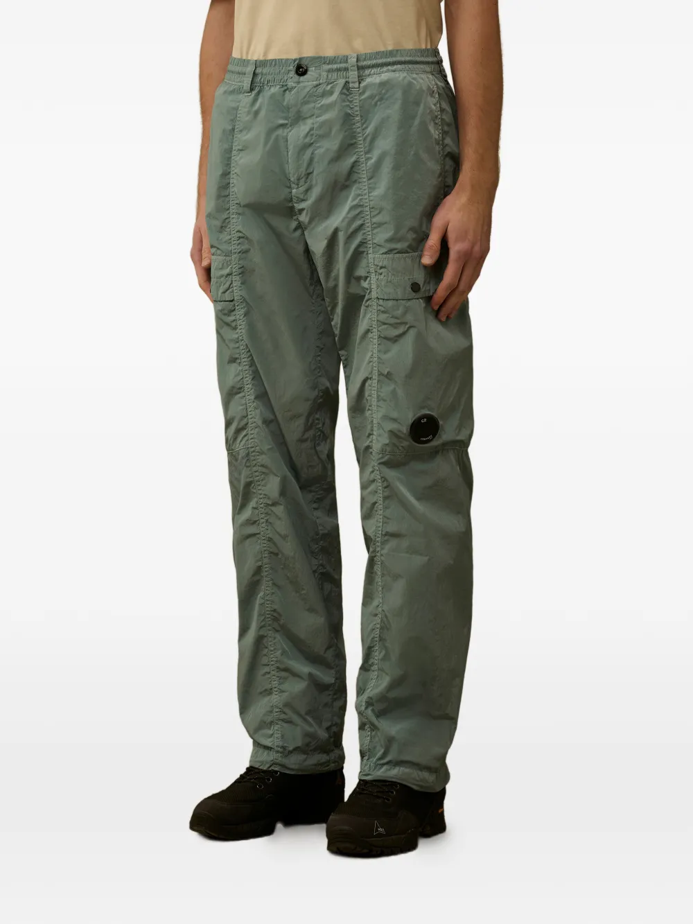 green pants worn by a person, showing the pants fit