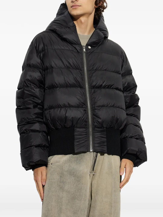 Black jacket worn by a person, showing the jacket fit
