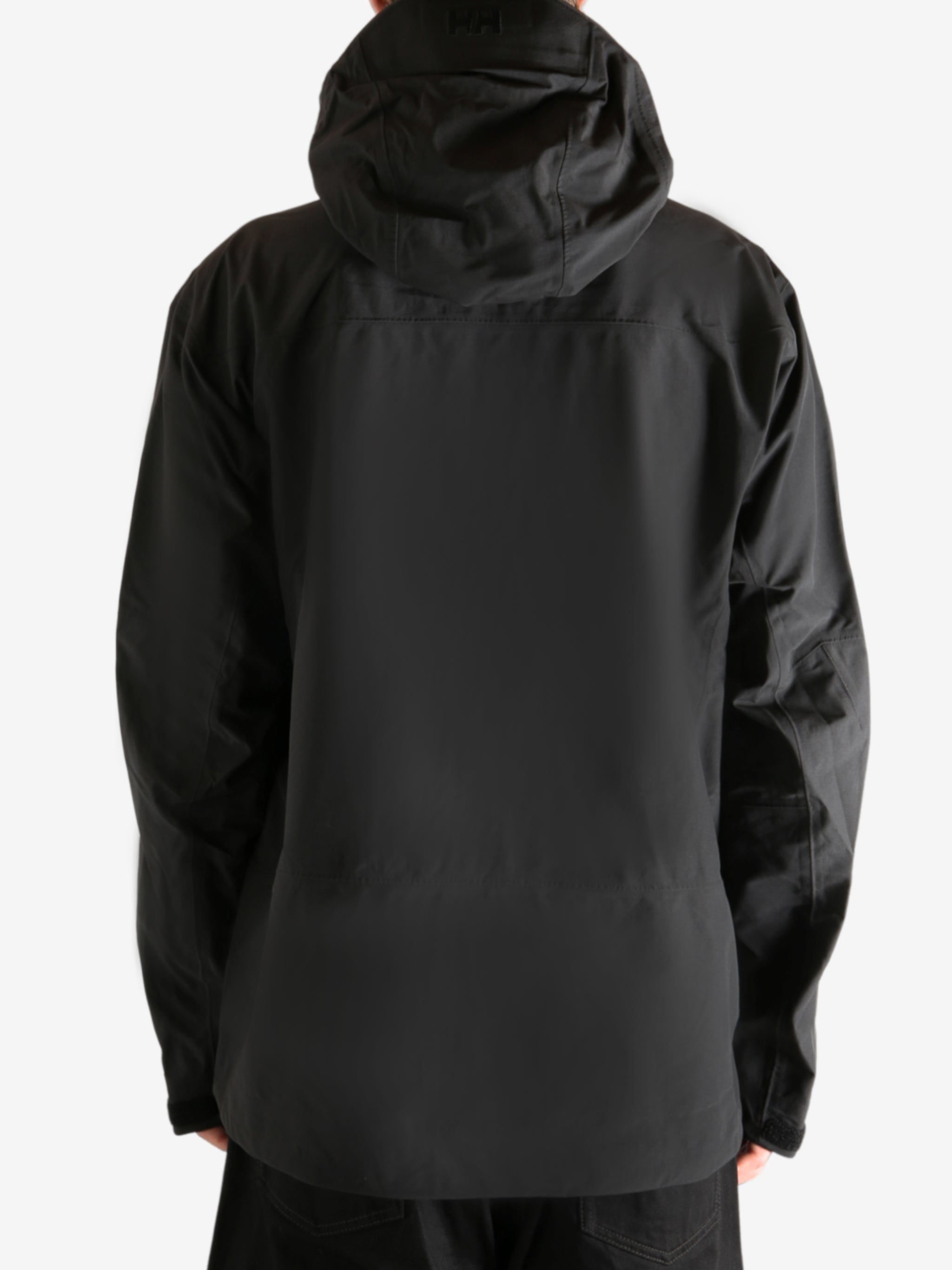 Black jacket worn by person, showing the jacket's fit