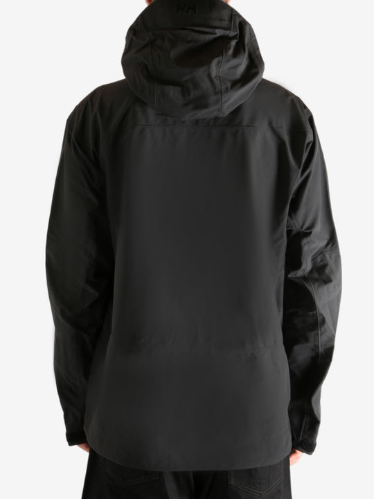 Black jacket worn by person, showing the jacket's fit