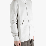 White hoodie worn by a person, showing the hoodie fit