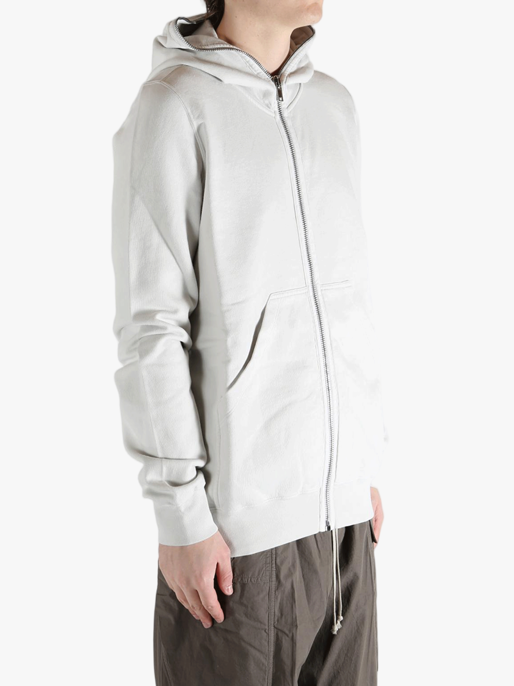 White hoodie worn by a person, showing the hoodie fit