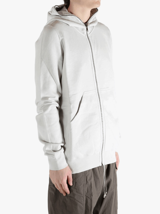 White hoodie worn by a person, showing the hoodie fit