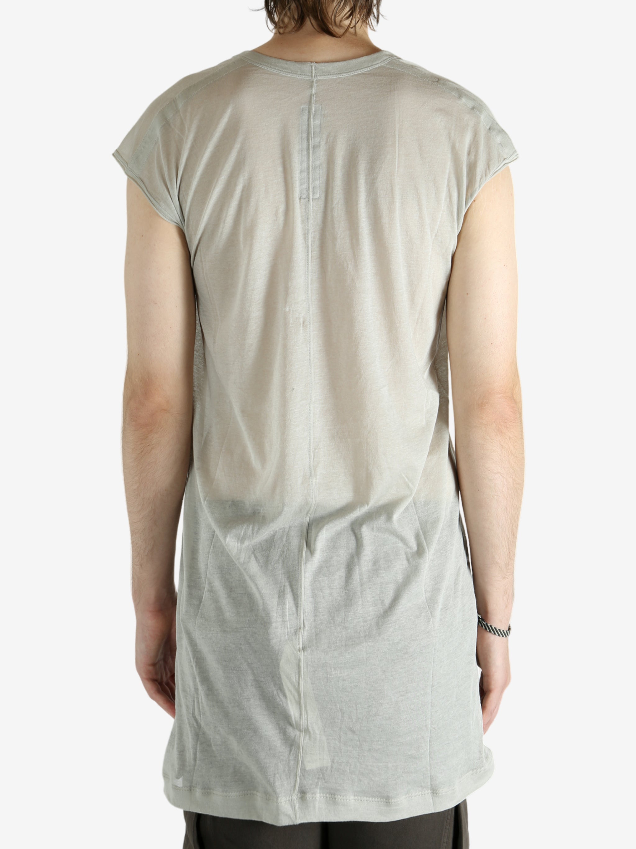 White t-shirt worn by a person, showing the shirt's fit