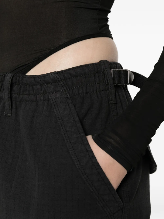 Close up of black pants, showing texture of the cotton fabric