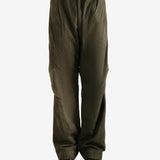 Green pants worn by a person, showing the pants fit