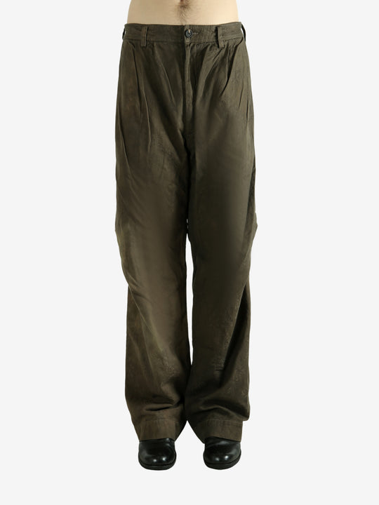 Green pants worn by a person, showing the pants fit