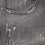 Close up of the balck jeans, showing texture of the cotton fabric