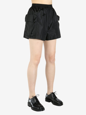 Black shorts worn by a person, showing the shorts fit
