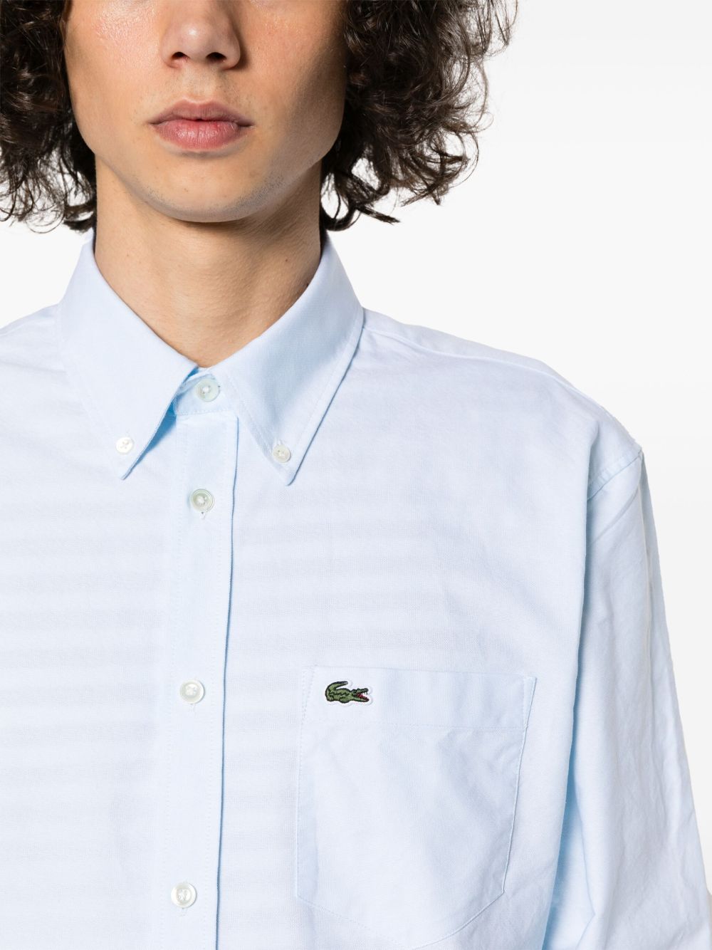 Close up of blue shirts, showing texture of the cotton fabric