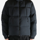 Black jacket worn by a person, showing the jacket fit