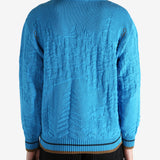 Blue jumper worn by a person, showing the jumper's fit