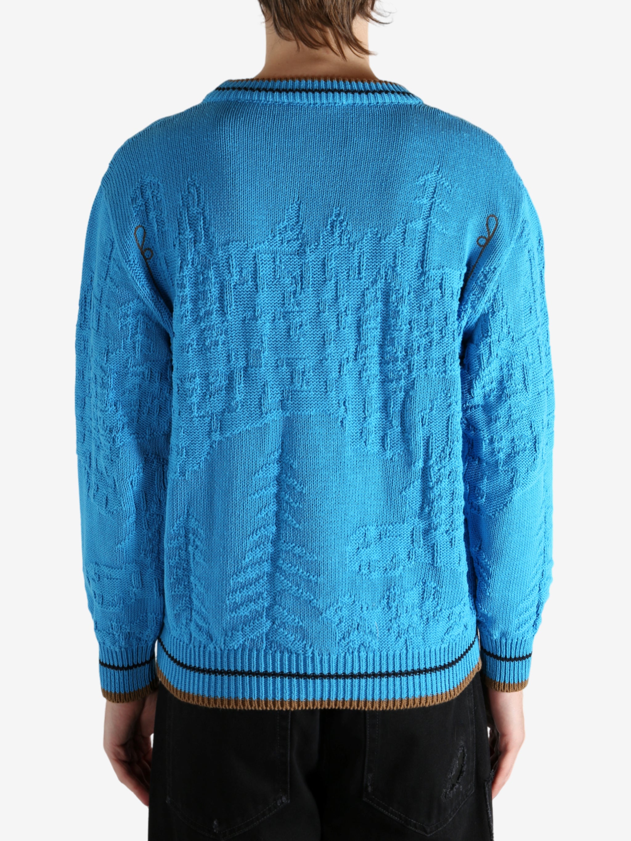 Blue jumper worn by a person, showing the jumper's fit