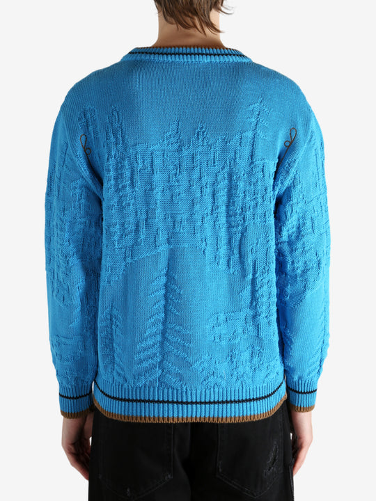 Blue jumper worn by a person, showing the jumper's fit