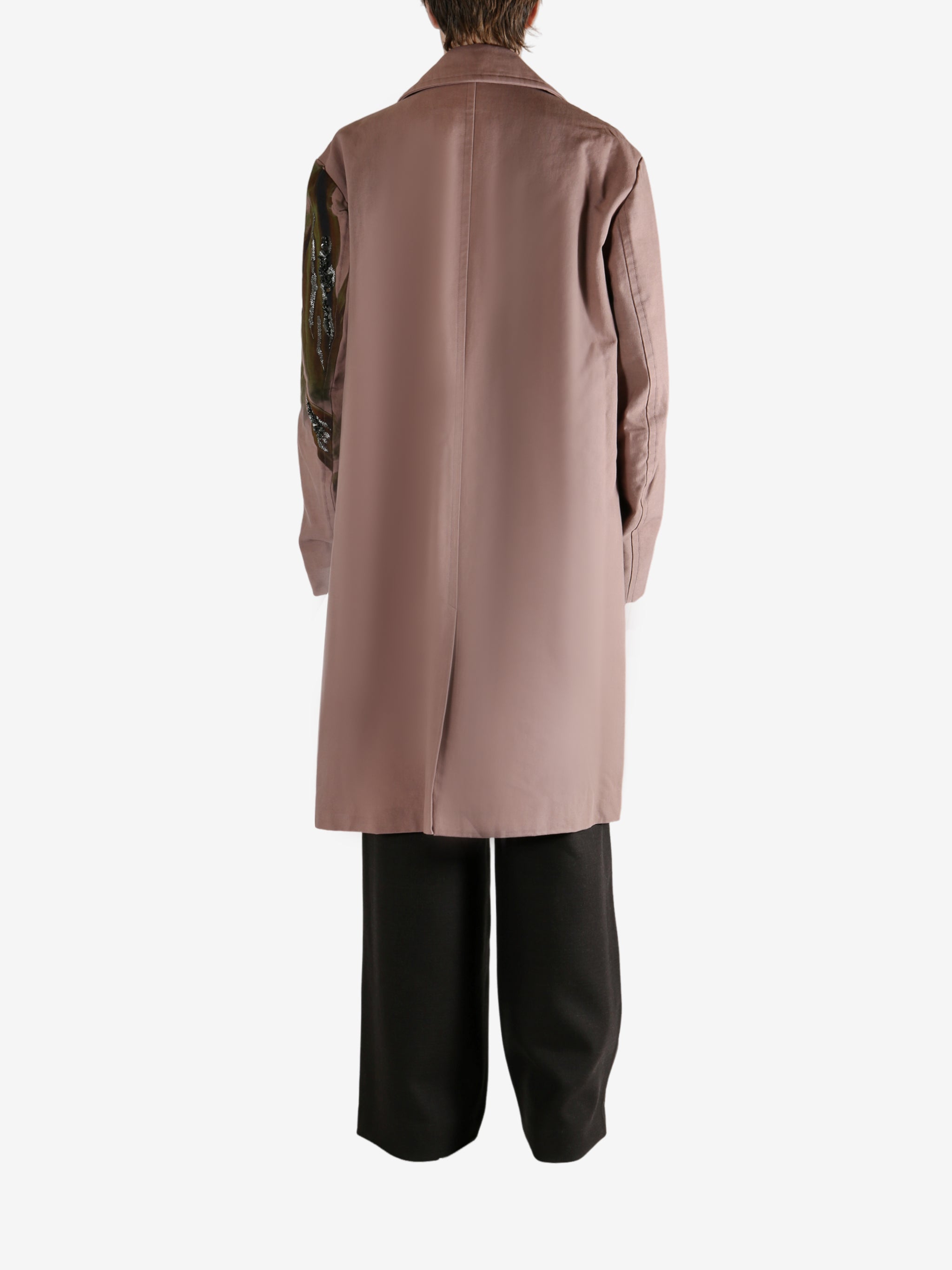 Pink coat worn by a person, showing the coat's fit