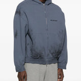 Blue hoodie worn by a person, showing the hoodie's fit