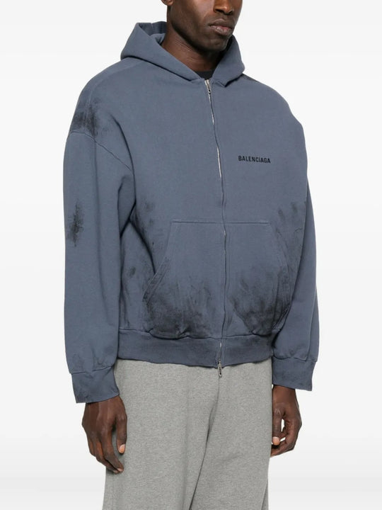 Blue hoodie worn by a person, showing the hoodie's fit