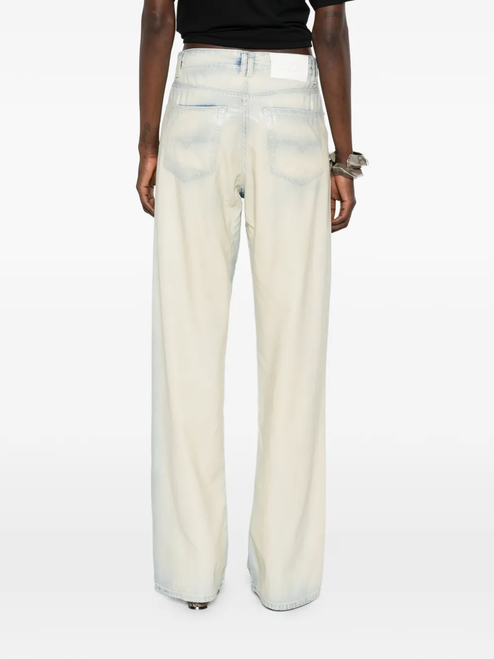 grey pants worn by a person, showing the pants' fit