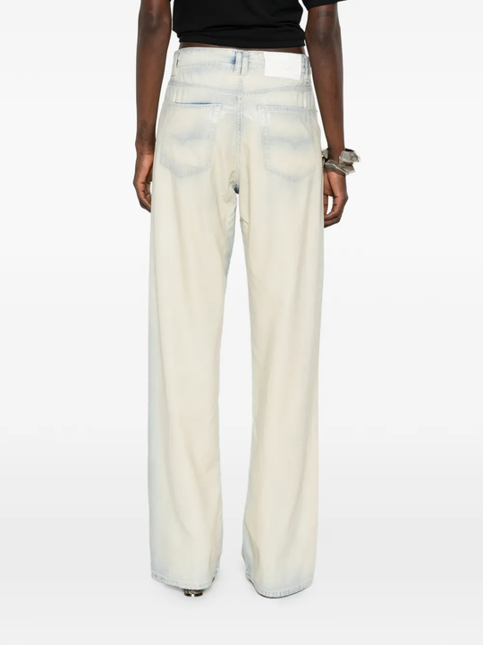 grey pants worn by a person, showing the pants' fit