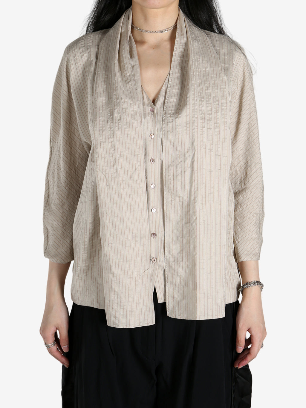 Tan shirts worn by a person, showing the shirts fit