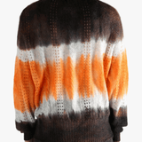Orange cardigan worn by a person, showing the cardigan's fit