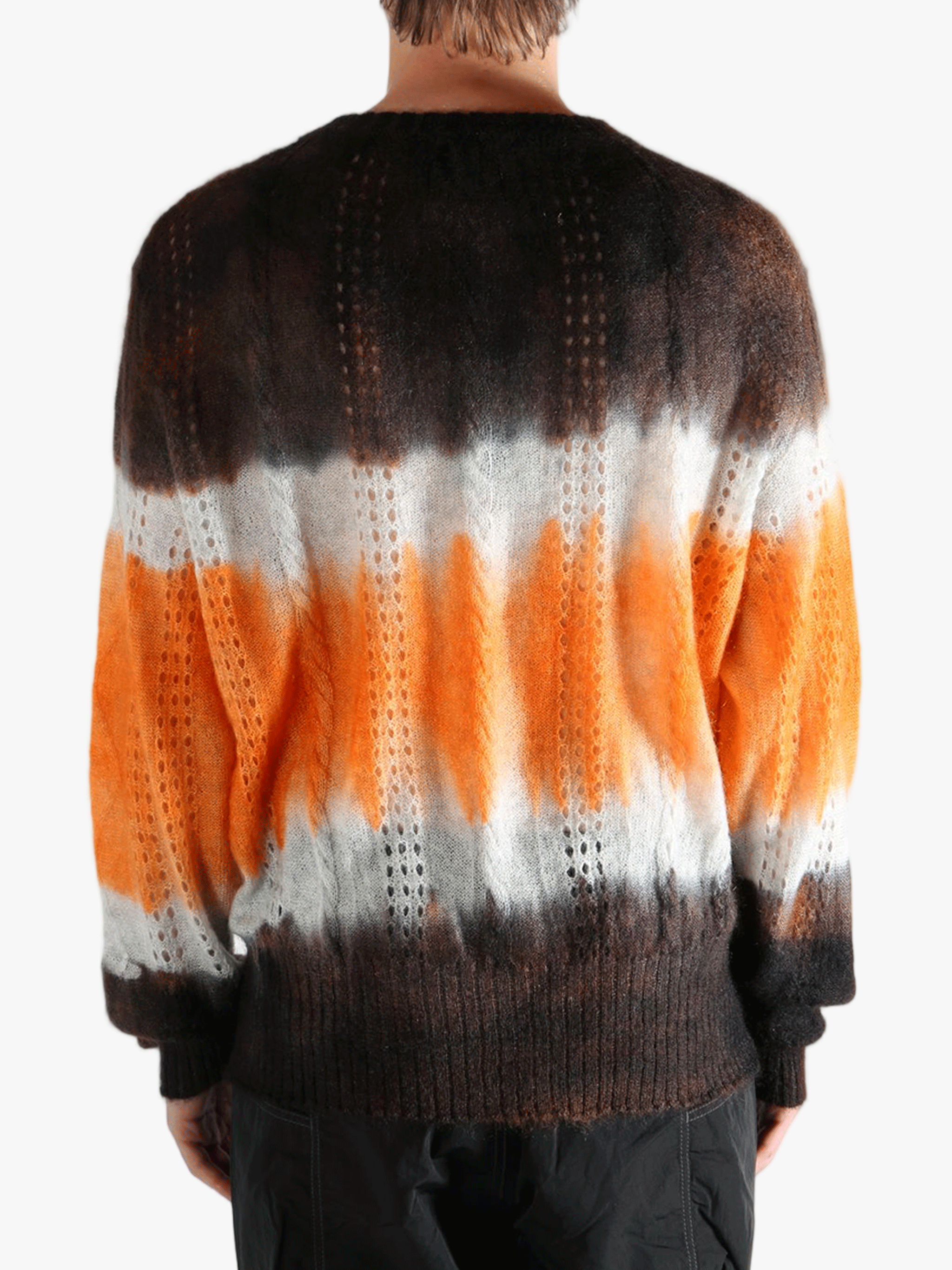 Orange cardigan worn by a person, showing the cardigan's fit