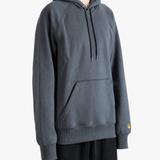 Grey hoodie worn by a person, showing the hoodie fit