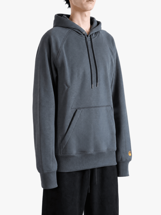 Grey hoodie worn by a person, showing the hoodie fit