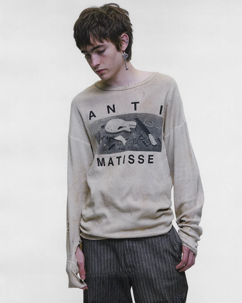 Tan t-shirt worn by a person, showing the t-shirt fit