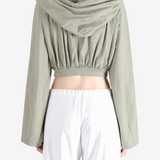 Green top worn by a person, showing the top fit