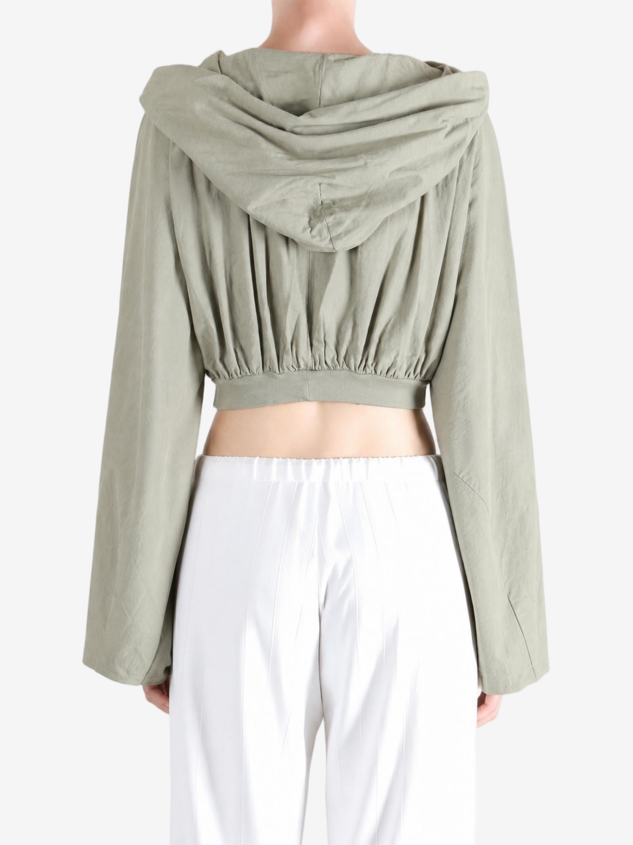Green top worn by a person, showing the top fit