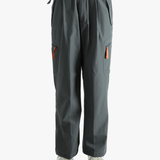 Black pants worn by a person, showing the pants's fit